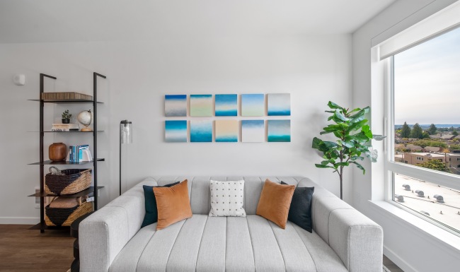 a couch in a living room with a window