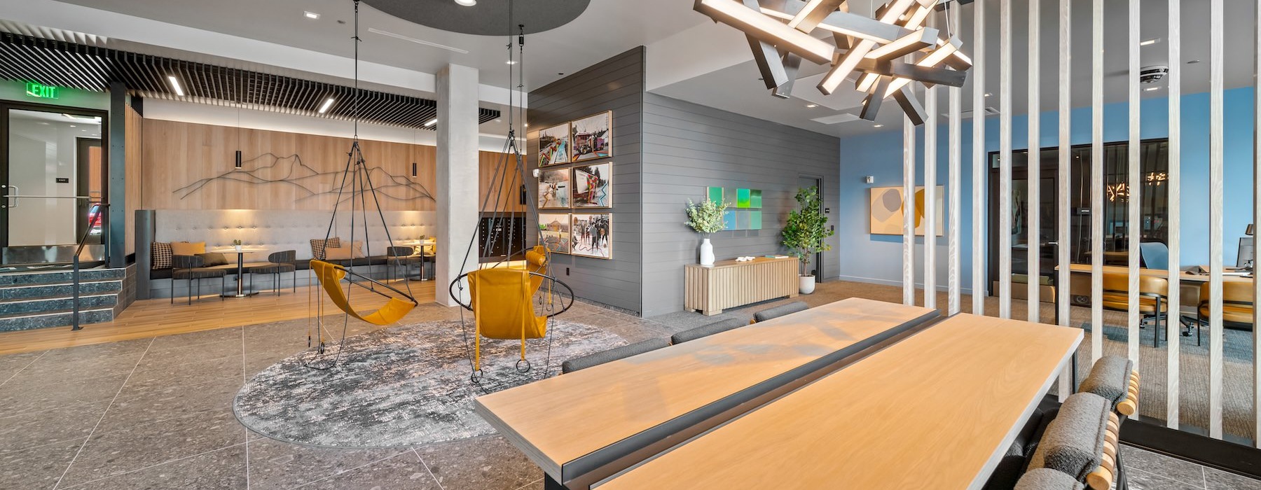 a clubroom with tables and chairs